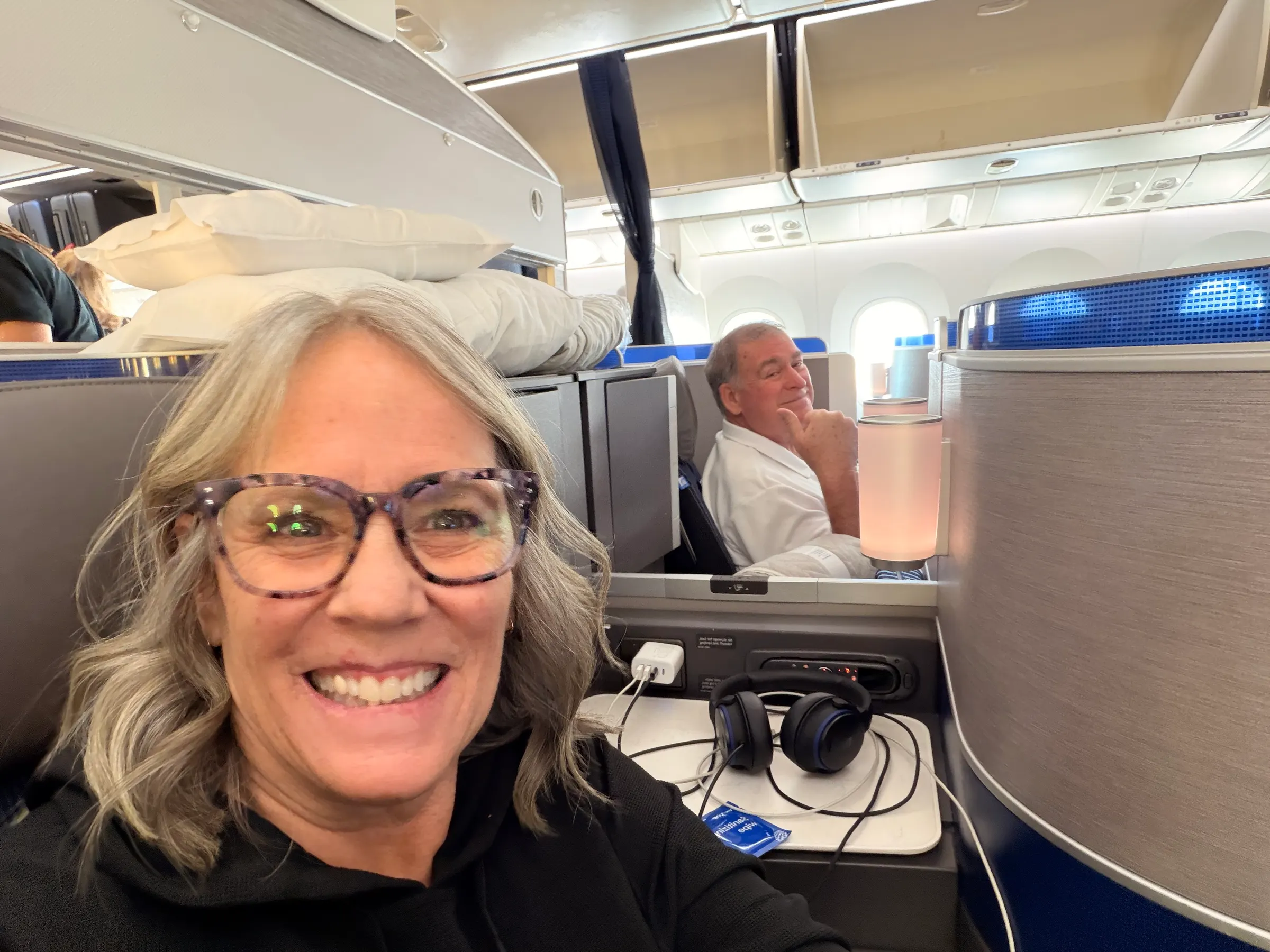Polaris (Business Class)…the only way to travel. Non-stop food, lay flat to sleep and nice entertainment setup.