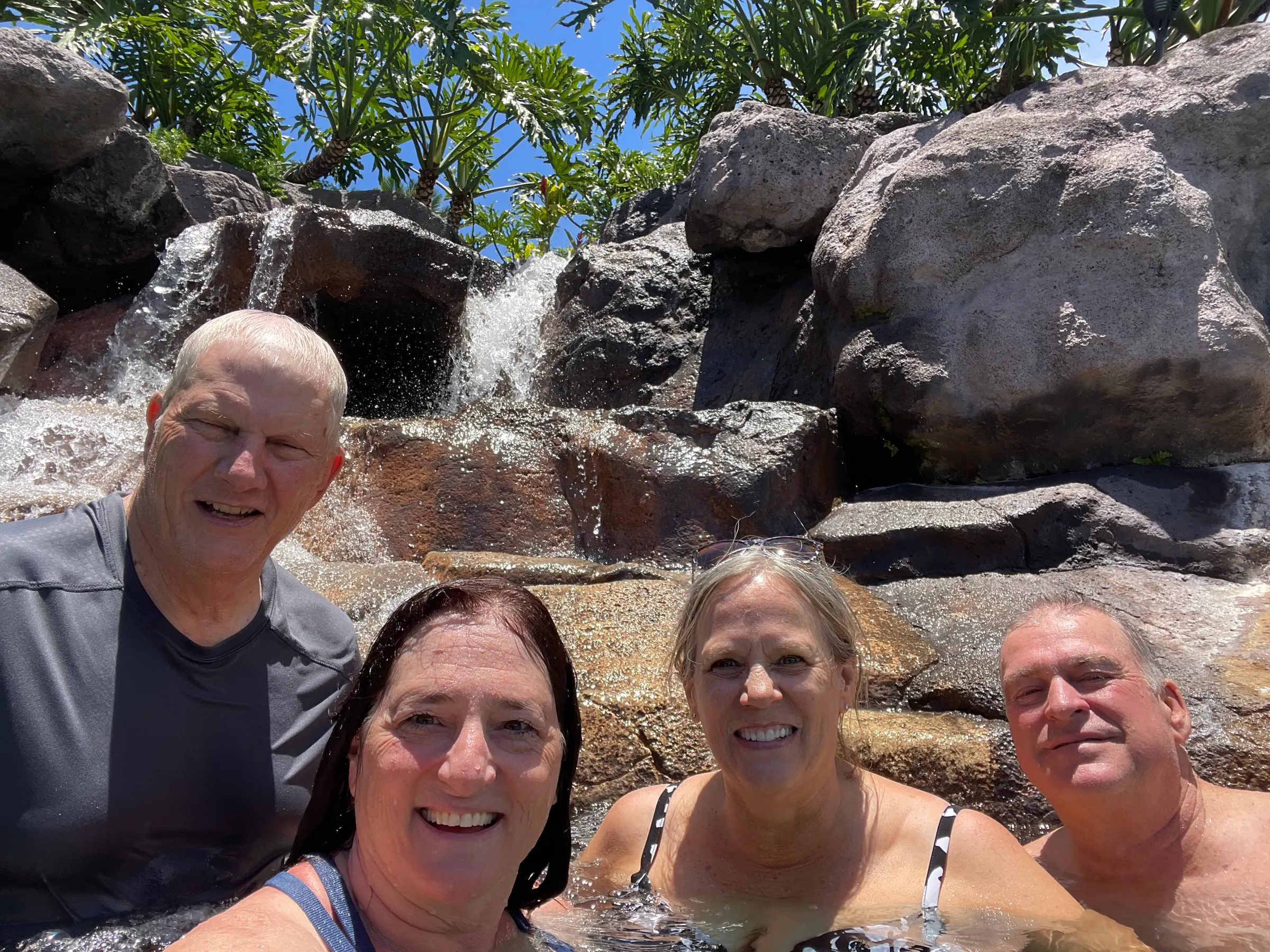Us enjoying the waterfall in the pool at the resort.