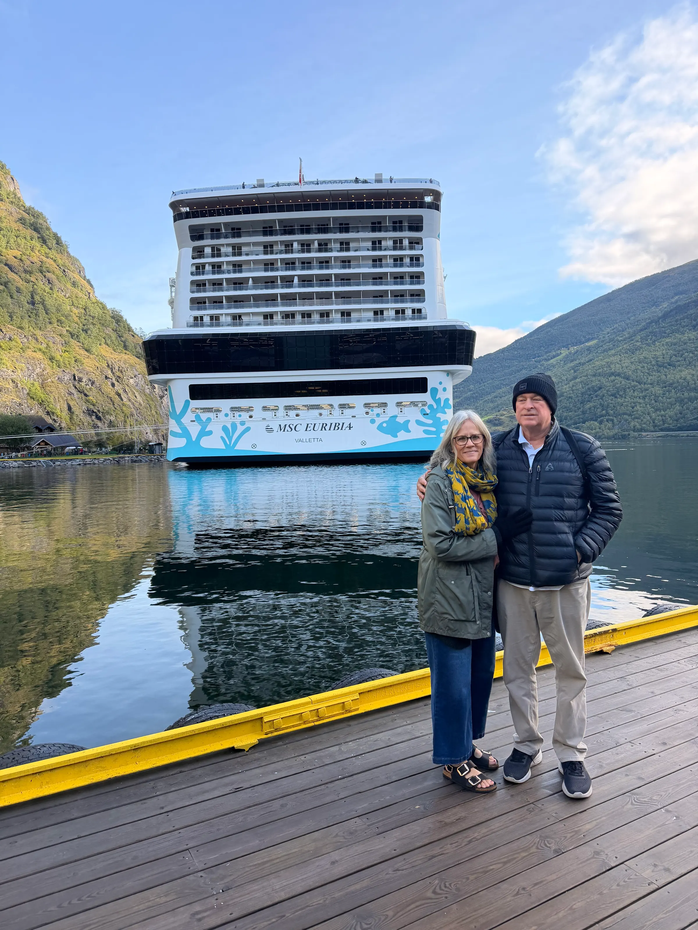 Us with our boat behind us. We’ve had a very nice time.