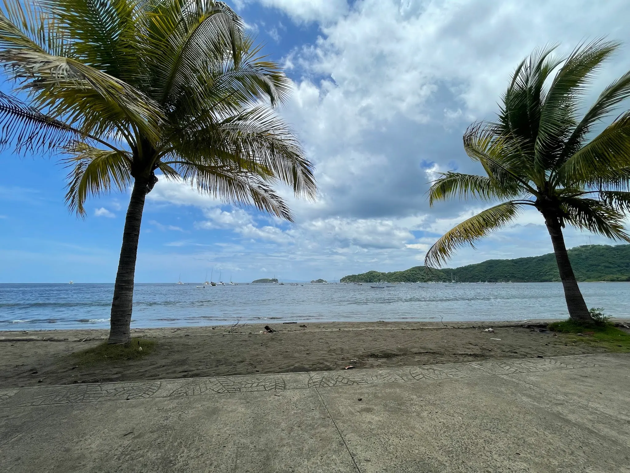 Looking out into the bay at Playa Del Coco. The water was quite close. We actually were sitting on some cement bench that was by the park. Sprinklers actually came on…which was amazing since this place is so green and so humid.