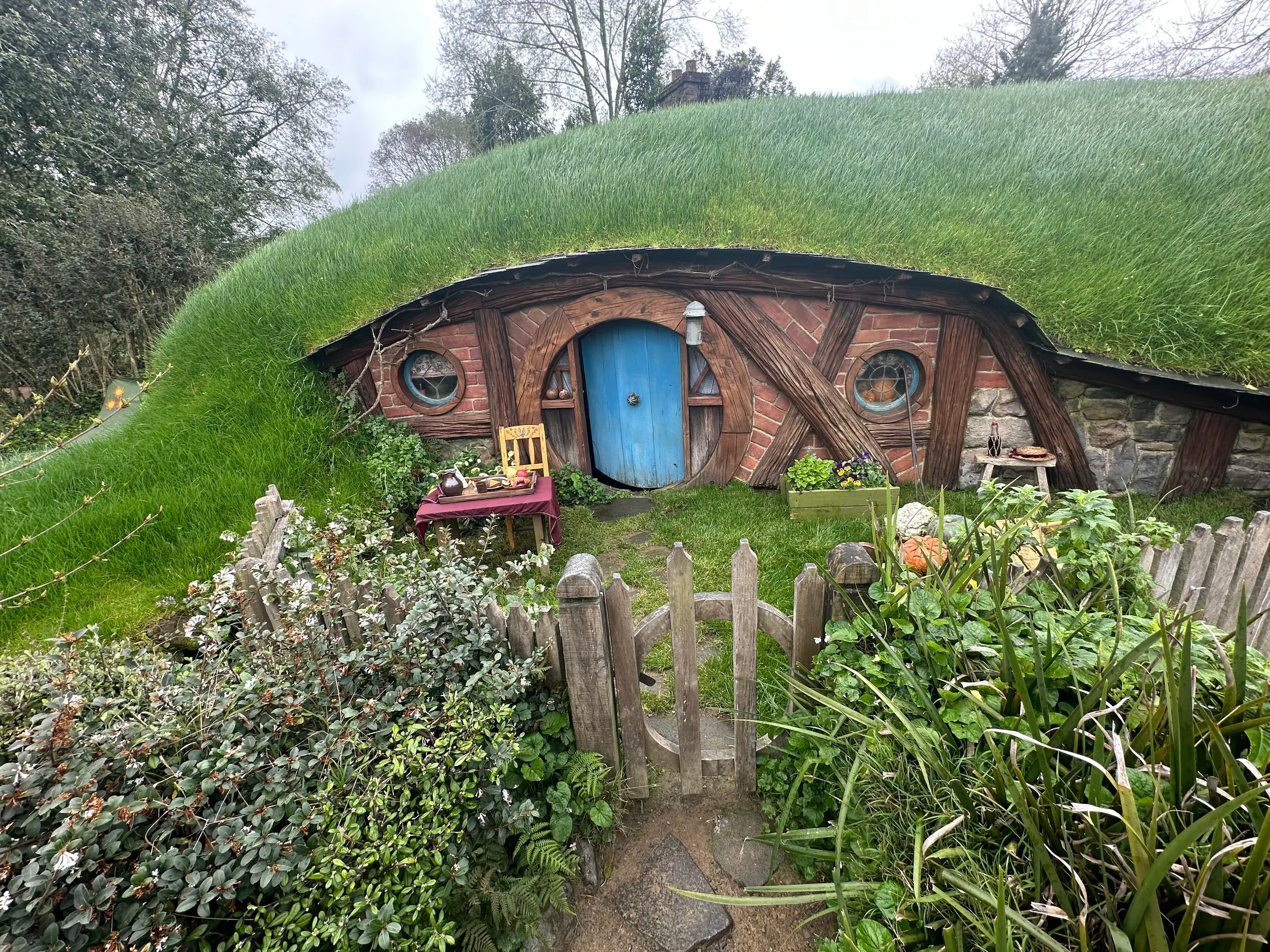 As you exit, because people complained that they never got to go into a hobbit hole, they created two holes that people could go into and admire. They are fairly new but beautifully constructed inside. I had to watch my head everywhere I turned.