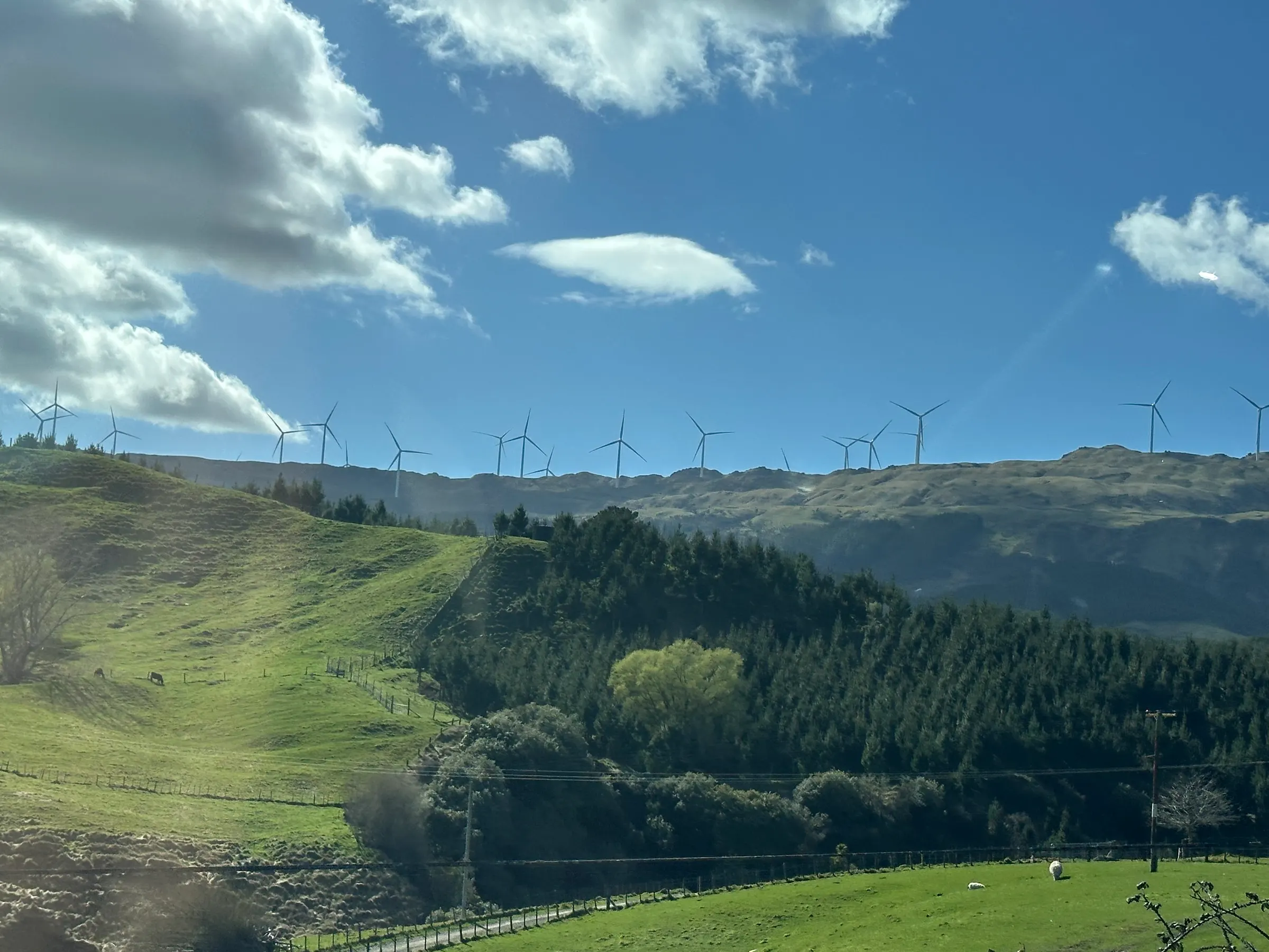 It’s really hard to get a good picture of the amazing landscape as we drive. But Denise did a good job trying get some of the beauty and the fact that they had windmills along the top of the mountains.