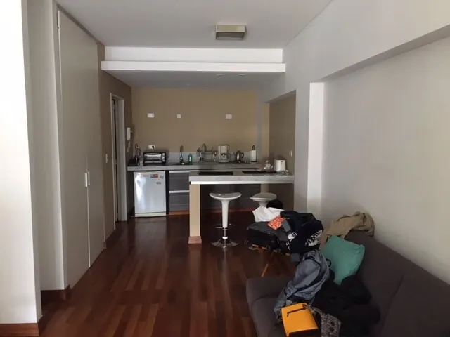 Our apartment looking towards the kitchen. It was a long narrow room. The bathroom is the door to the left of the kitchen.