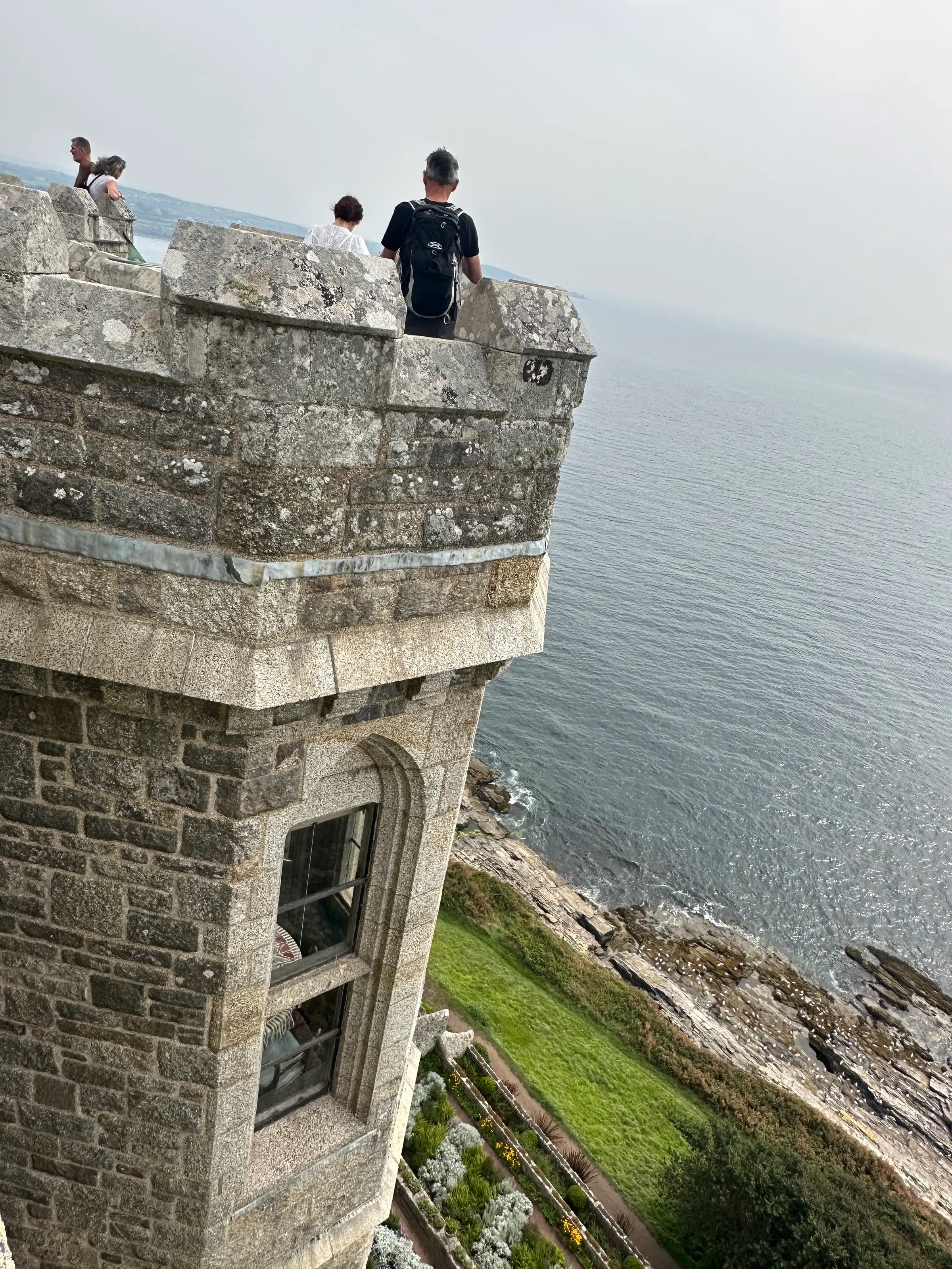 This photo shows the sheerness of the walls down to the next level with the gardens and sea below at St. Michaels Mount.