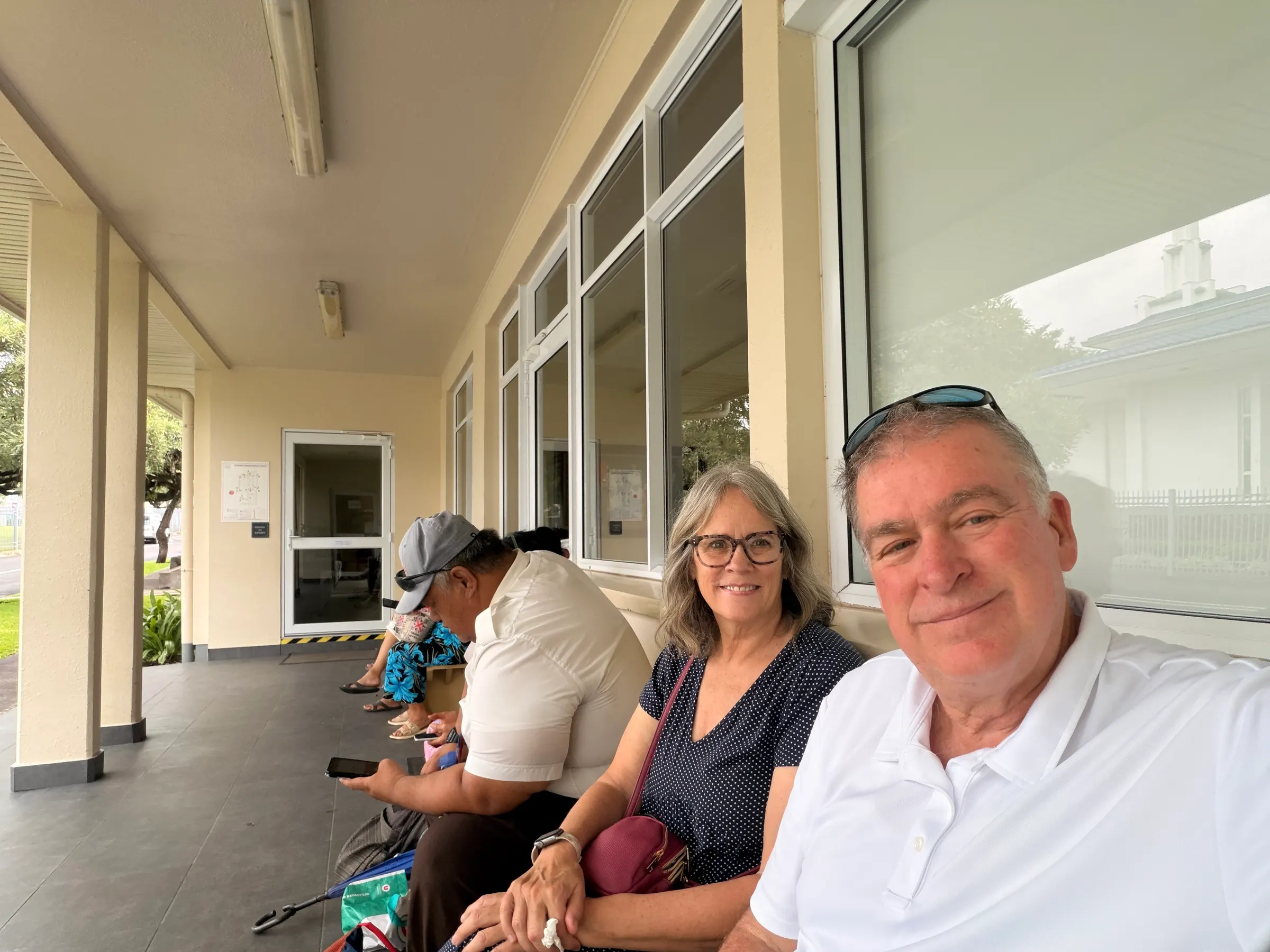 This is where we sat with some of the locals waiting to go into the temple. It was a bit warm and humid. The air conditioning of the temple felt so good once we entered.