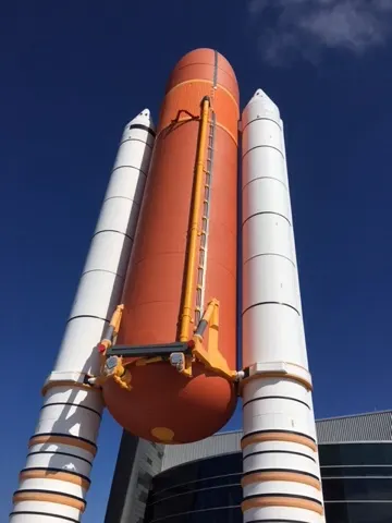 Booster rockets and fuel tank outside the Shuttle Atlantis exhibit....