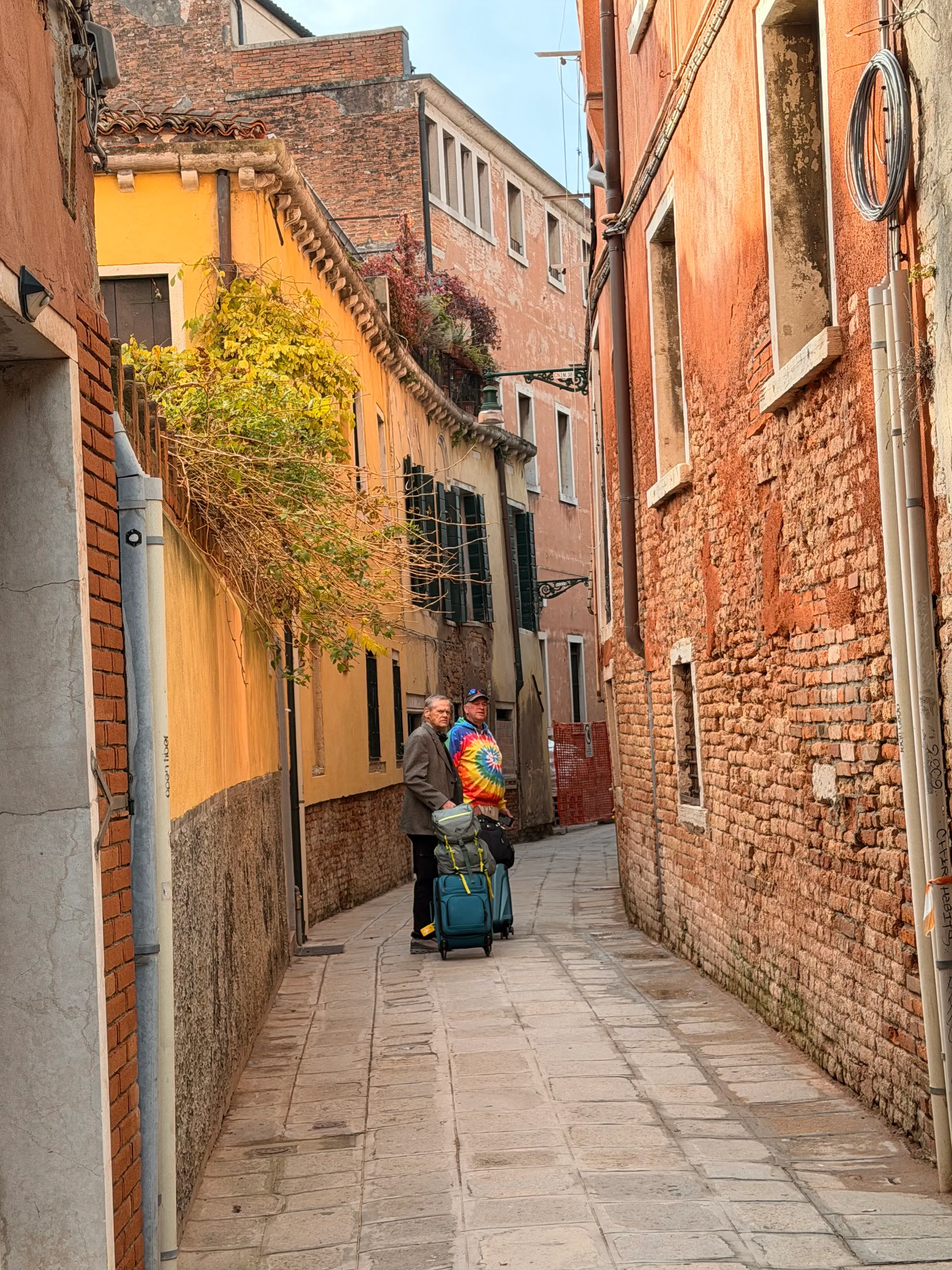 Dragging our bags to our apartment in one of the narrow streets.