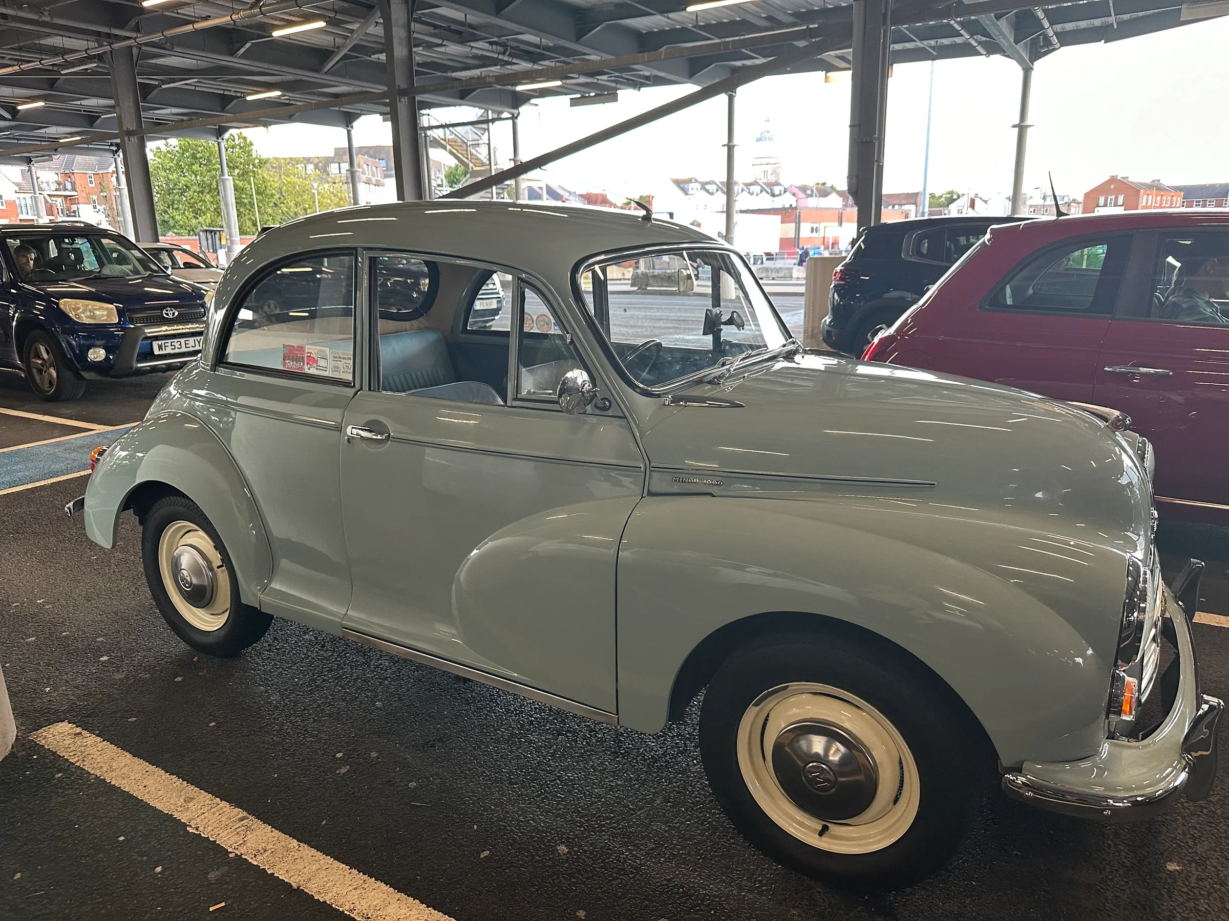 Old car waiting to get on the ferry.