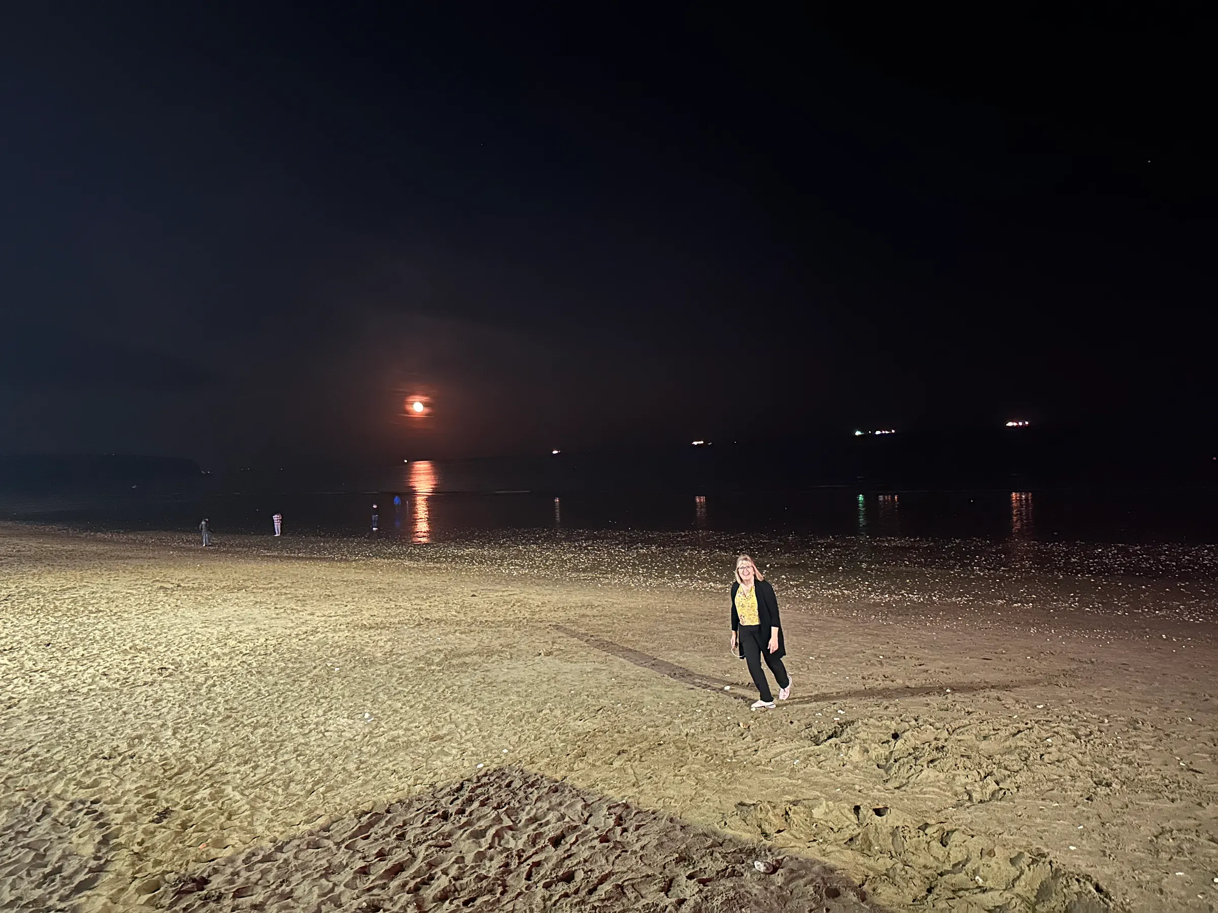 Sandown beach at night. Lisa enjoying it.