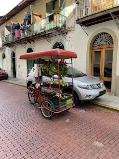 A fruit cart on the streets of old town. Fresh fruit anyone?