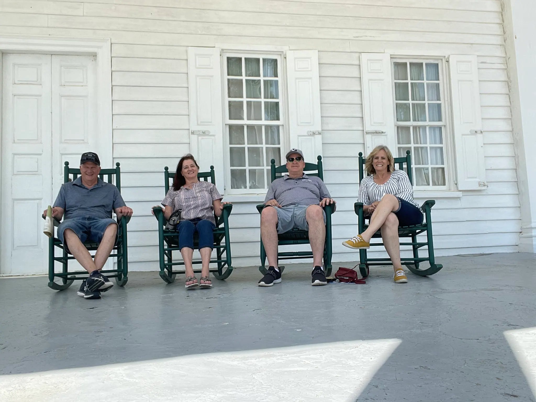 The owners and their slaves sitting on the porch. I’ll let you guess which is which! :-)