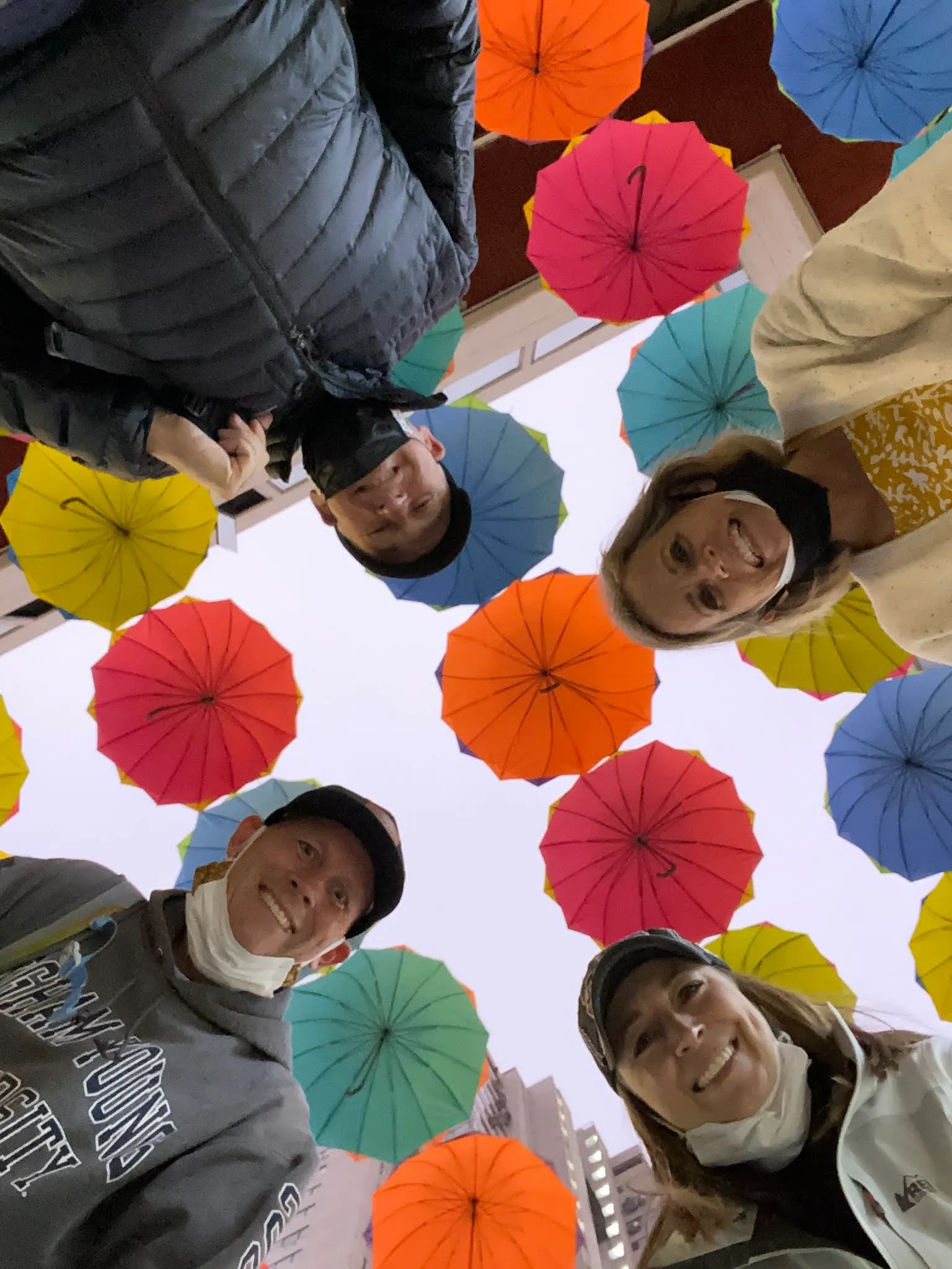 Just a crazy photo when the camera is on the ground and us looking at it. Above us are some colorful umbrellas. Made me think of the street in San Juan, Puerto Rico.