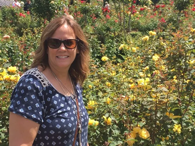 Denise in a field of yellow roses...
