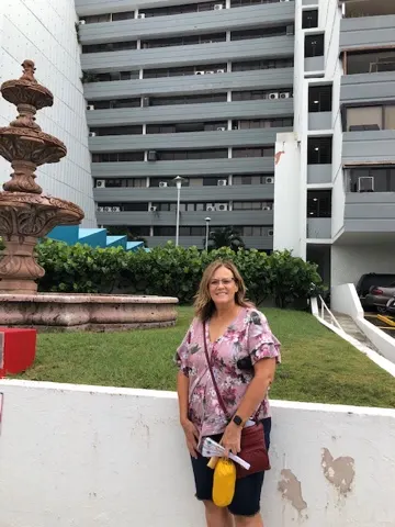 Out in front of our BNB building. We are in the room, 5 floors up to the far left.