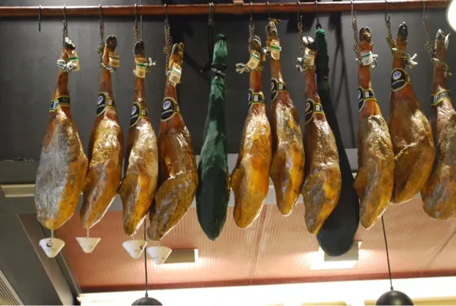 These ham shanks were hanging by our table where we ate lunch. The little bowls underneath some of the shanks catches fluids still dripping. Yum!