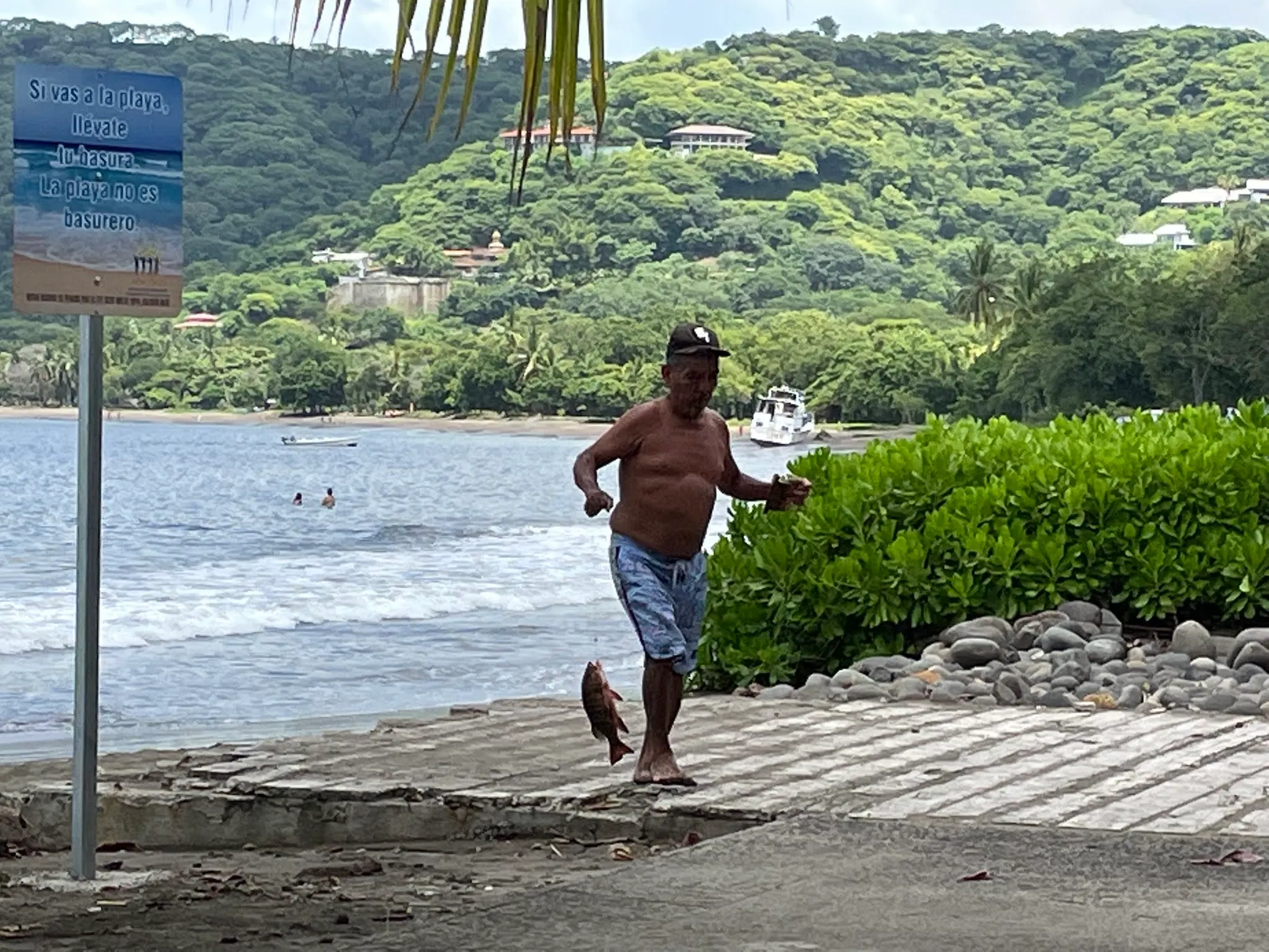 The successful fisherman. He eventually gutted it and prepared it to take home for dinner before we went back to the waters edge. You can see he has no pole.
