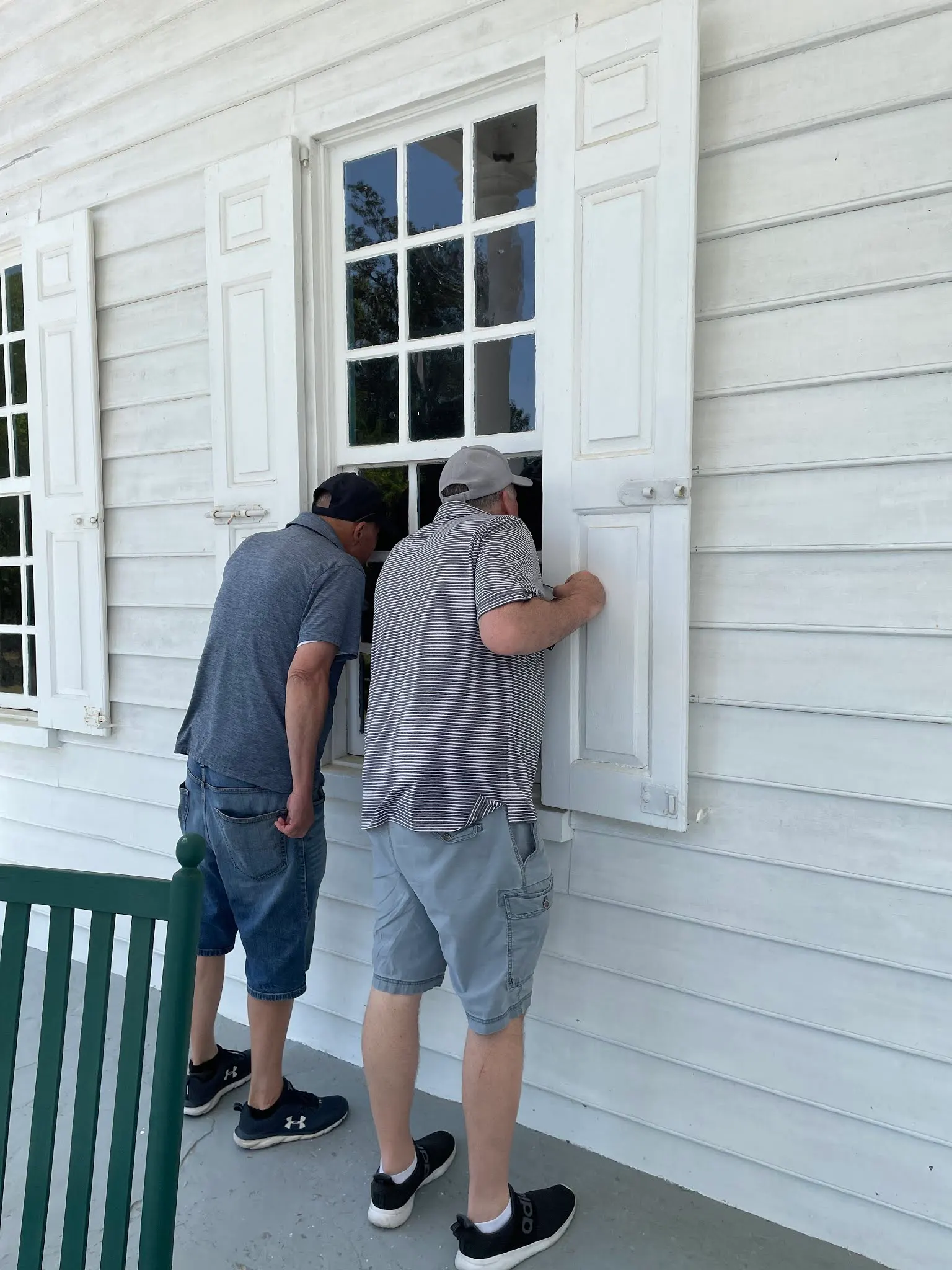 Peeping im’s .... Tim and Kim peeking through the windows of the plantation mansion.