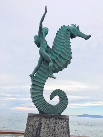 Bronze statues line the Malecon. This ride, to me, looks uncomfortable!