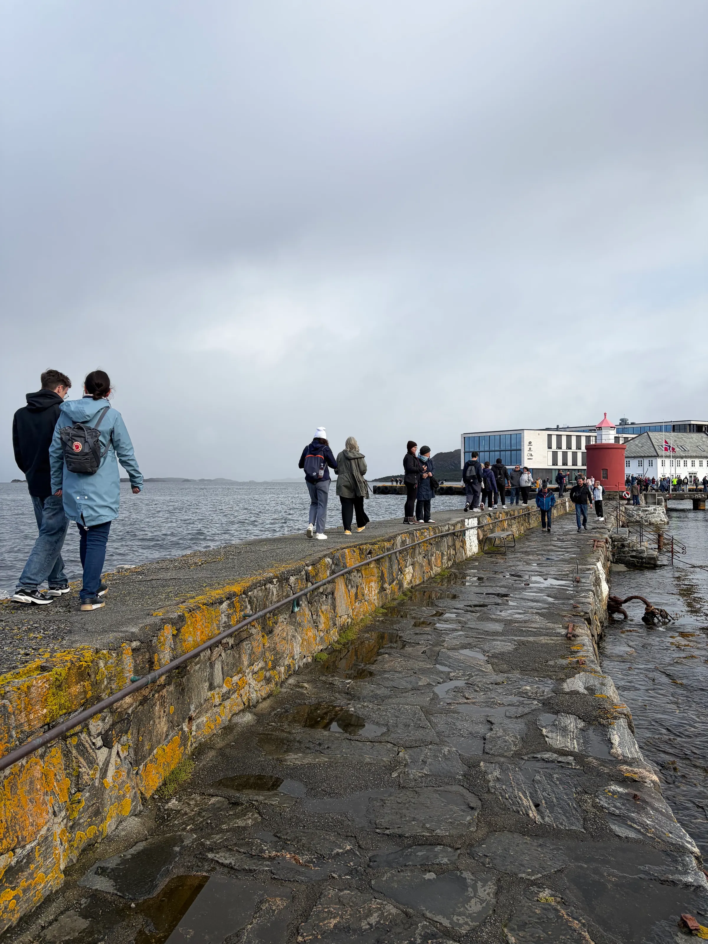 You can see Denise and Ilene walking together as they head out the the little lighthouse near the downtown area of the city of Alesund.