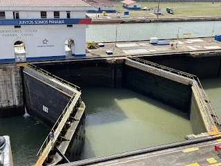 The lock is lowering when we took this picture. To the far left, this lock is raising the water. Eventually the two doors open and the boat is pulled through.
