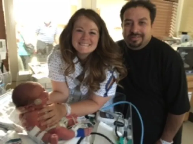 The happy family with baby Lorenzo who is hooked up to many devices.....