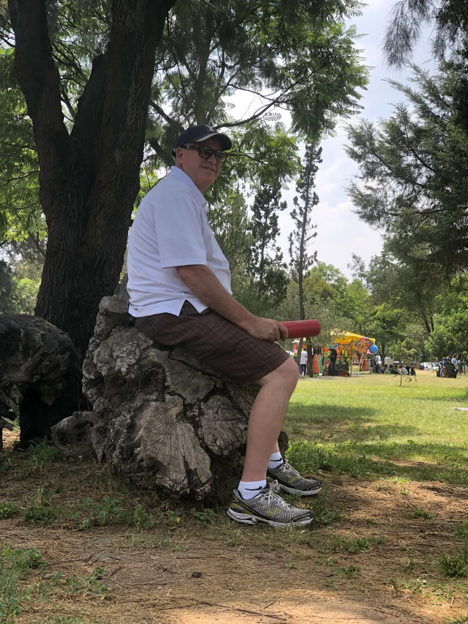 Sitting under a tree in a park. I had just called my Dad and spoke with him for a few minutes. All well there he said....