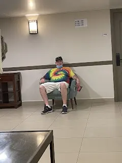 Me waiting to get into my room. The lady that was cleaning rooms asked if we wanted to have our room cleaned. So we let here and just waited outside. We eventually returned while she was there and went out on our balcony.