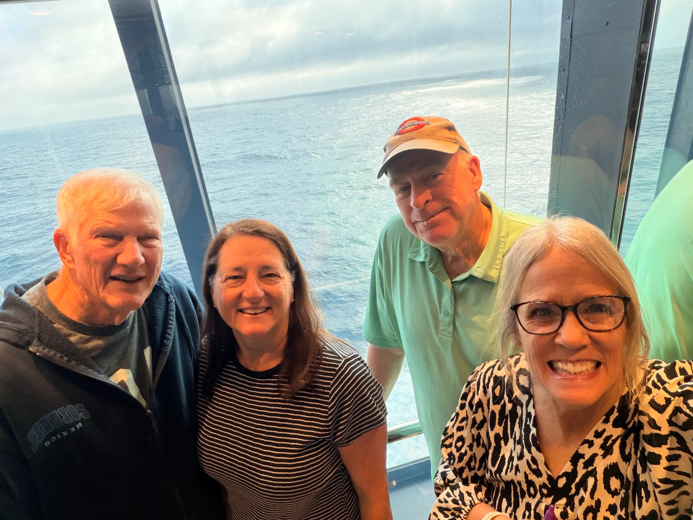 Us in the panoramic elevator that goes up and down looking out over the sea.