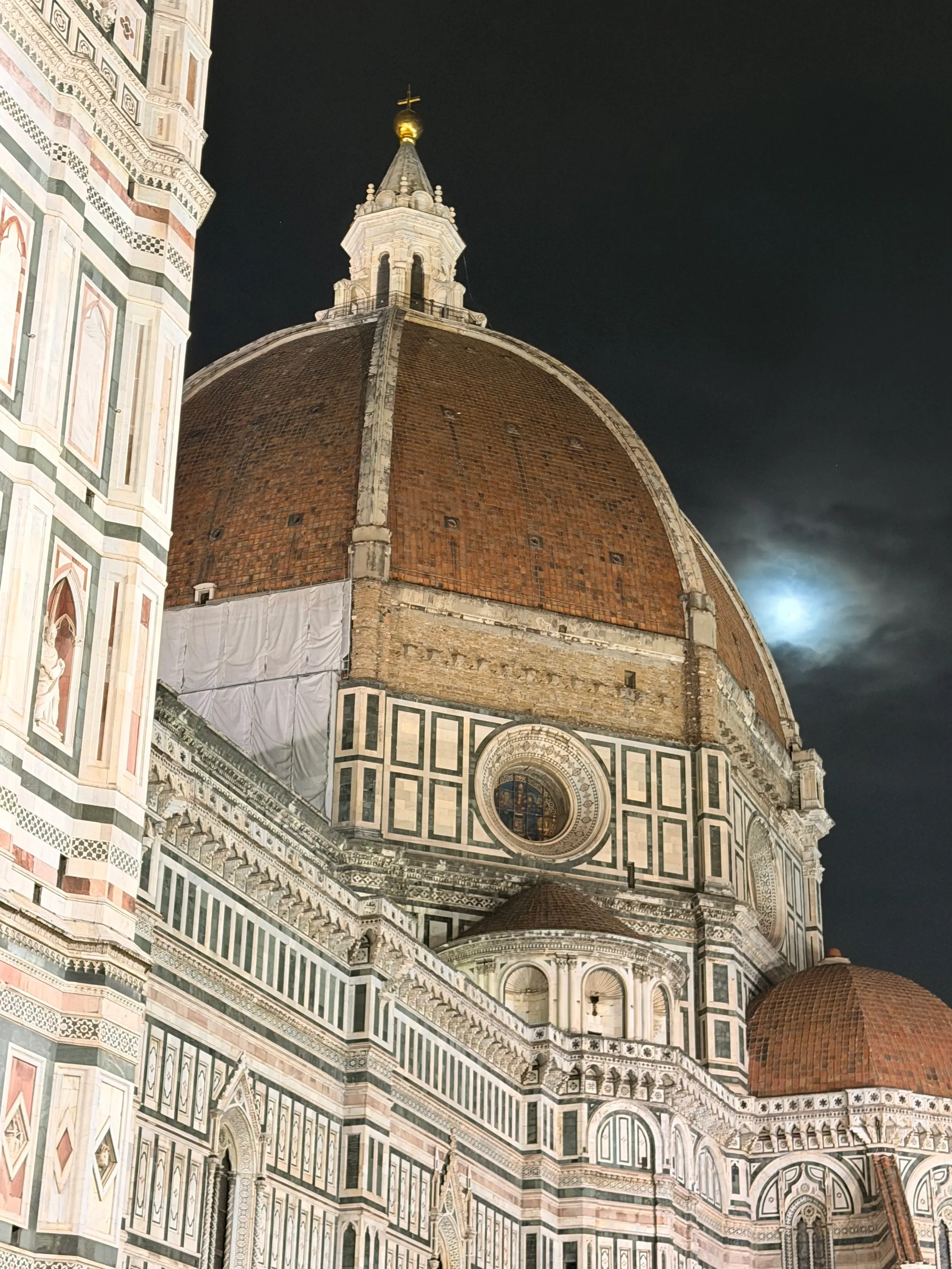 The moon rising over the Duomo Cathedral.