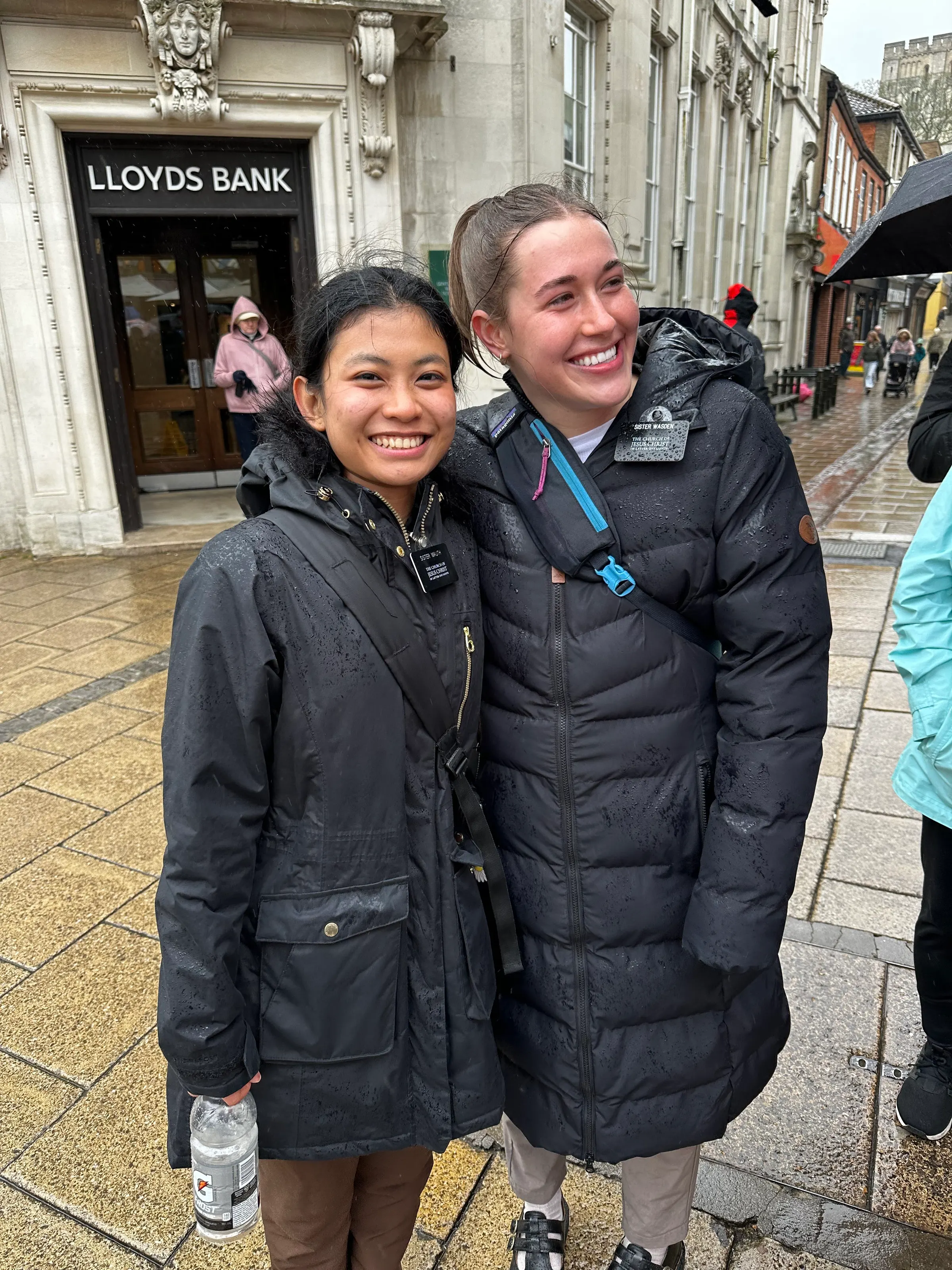 While at the market, I looked across the street and saw two young sisters talking to a man on the street. I quietly approached them and flashed my missionary badge. A big grin came across their faces and they wondered where I had gotten that. They were surprised to see 9 temple missionaries smiling at them.