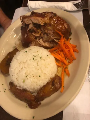 Some dinner...first picture is my plate...port roast with the pig skin left on it. I tried the skin...pretty chewy. But the roast, yummy! Denise's plate was a Cuban sampler. It was really good too.