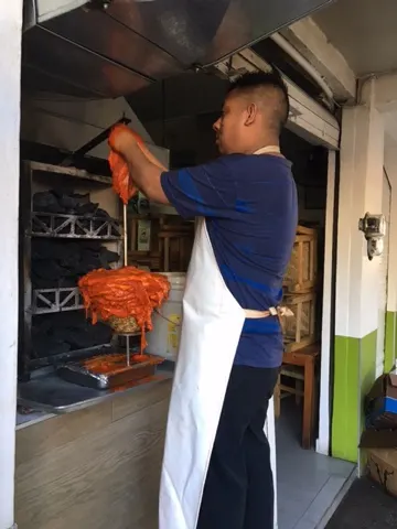 Preparing the 'Al Pastor' meat....it is stacked layer by layer.