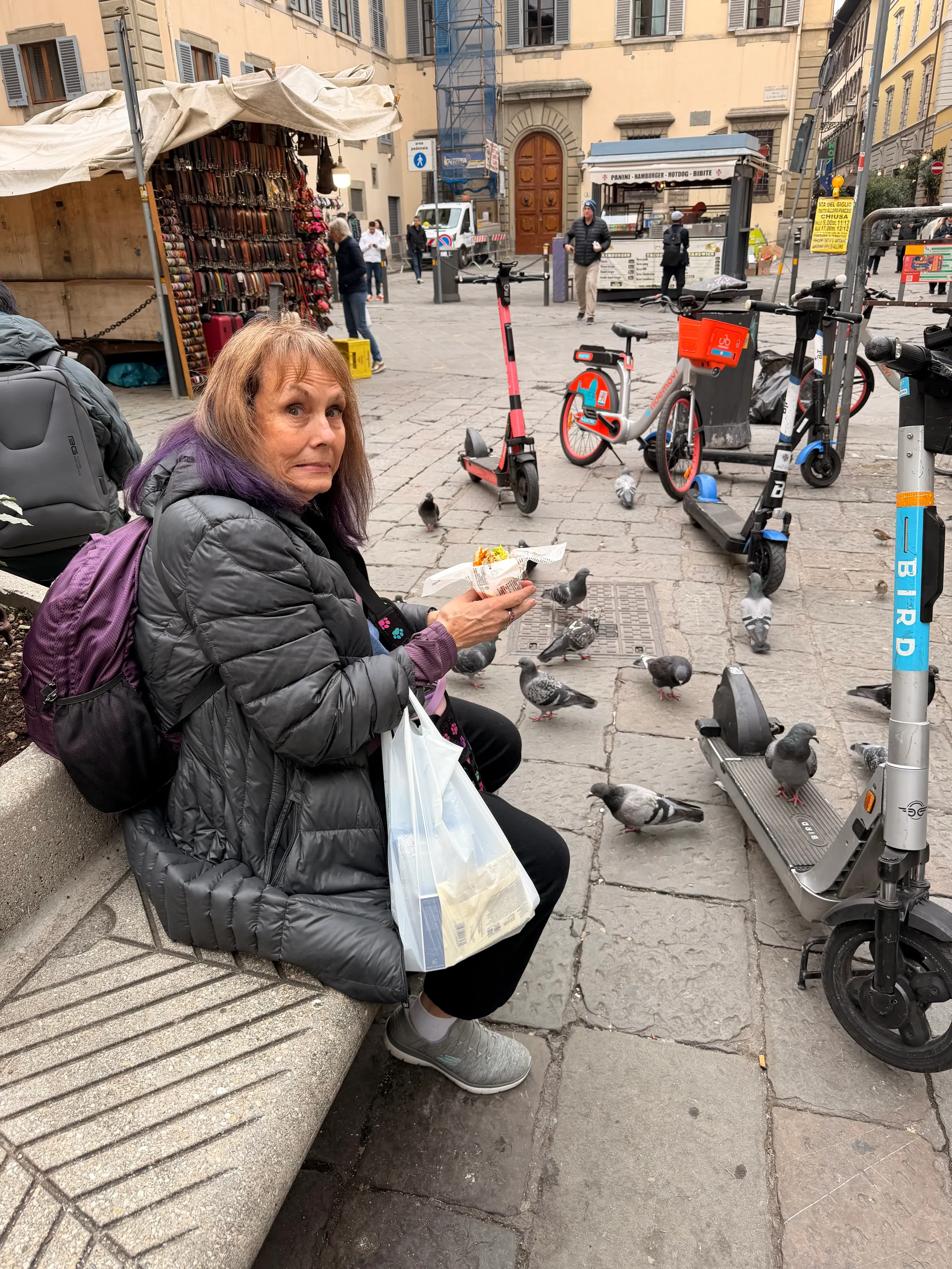 Mary Poppins feeding the birds. Pigeons are everywhere. We try to wear hats having been taught a lesson by Denise on Venice San Marcos square.