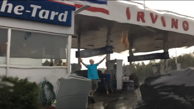 Crazy rain storm plagued us a bit on the drive. This is Dale coming out of place where we emptied our tanks and got gas. It was raining real hard...thus the blurry picture from inside the car.