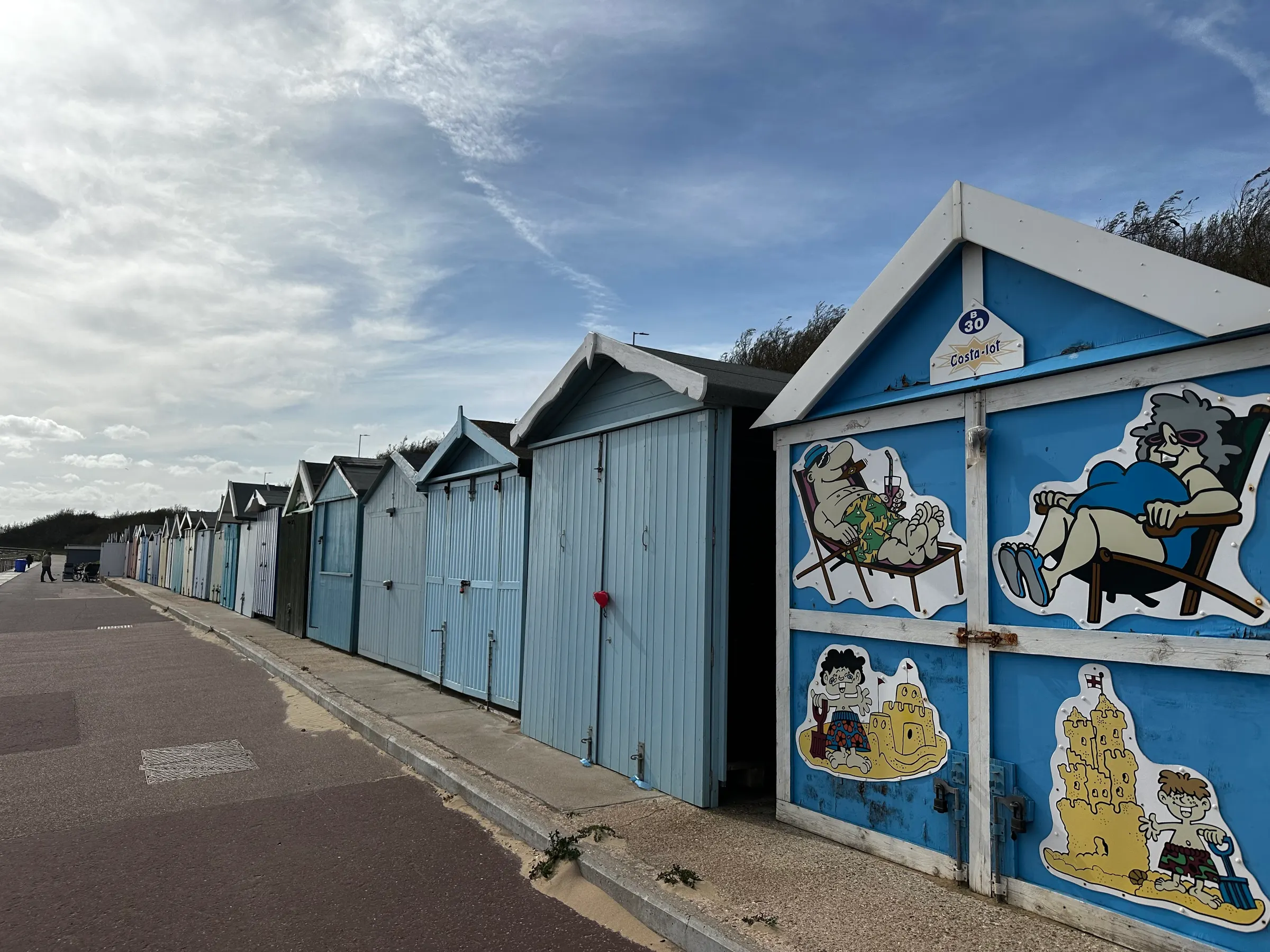 In England, all the beaches have these ‘sheds’ that are rented and\or purchased by individuals to be used while they are bathing in the sea. They contain their beach supplies but are big enough to allow people to sit in them, rest in them, etc.. Some people make them fancy.