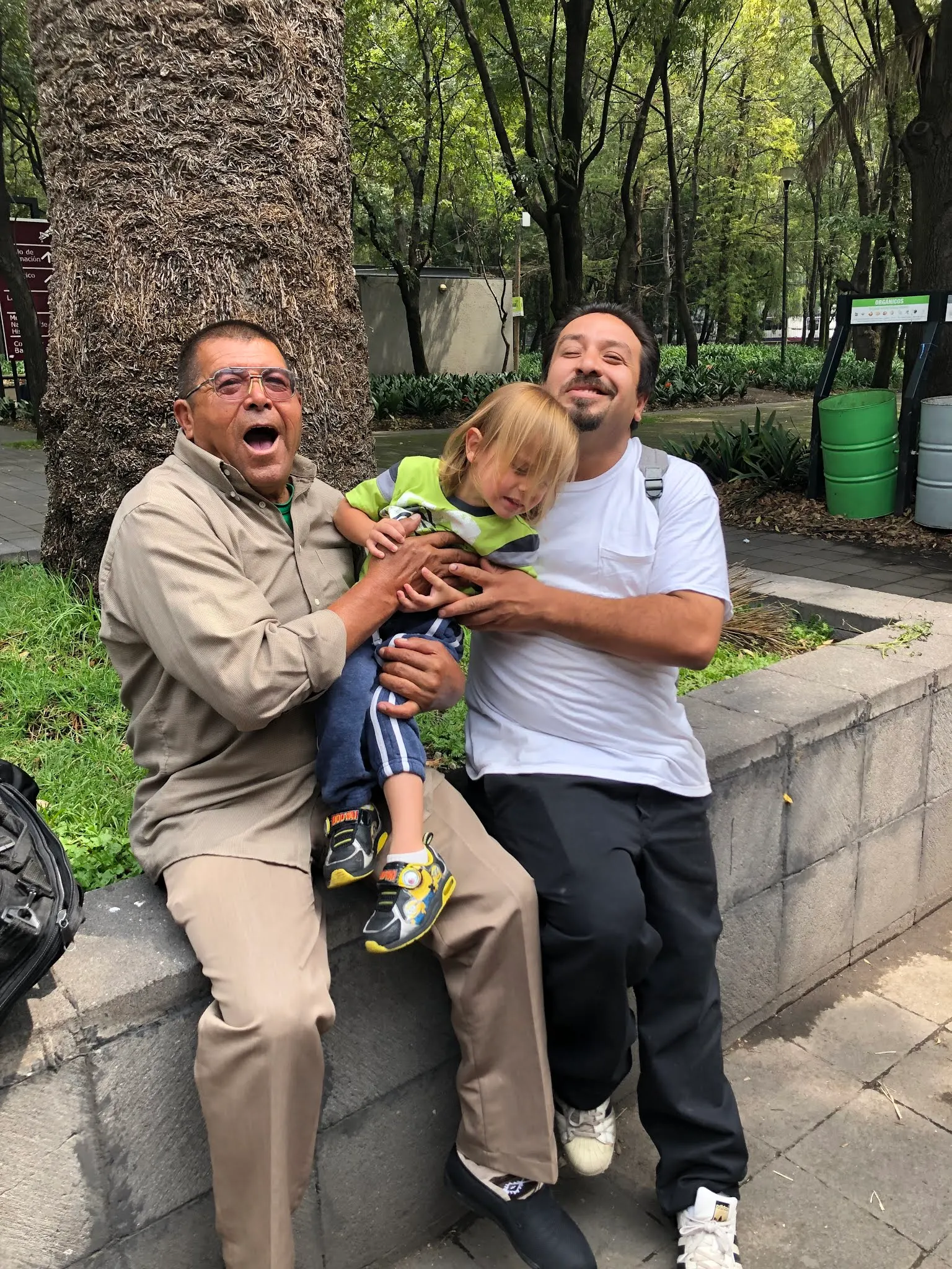 Two grown men wrestling one small boy and losing!!!!