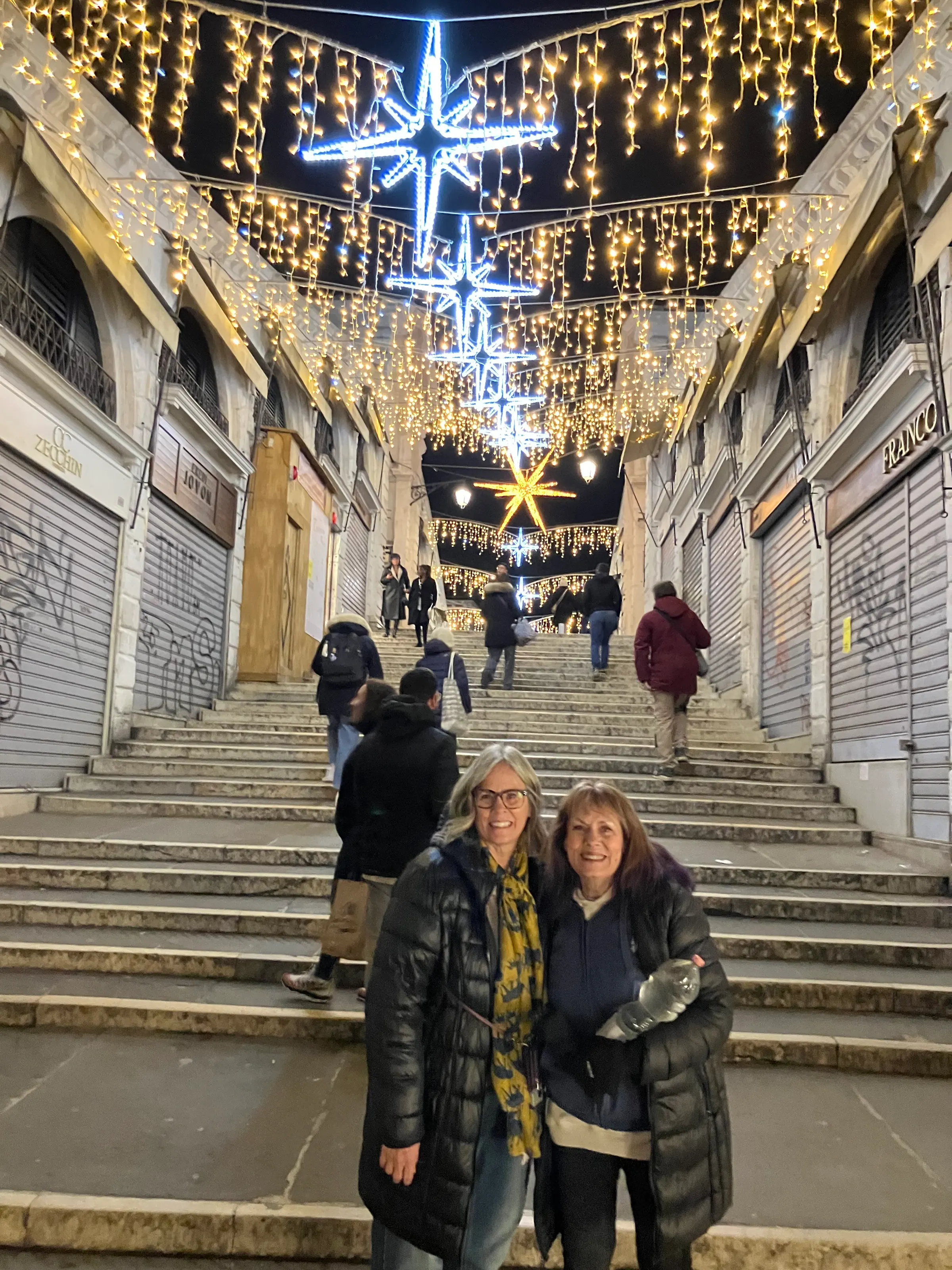 Lights on Rialto Bridge. Michelle and Denise…happy being together.