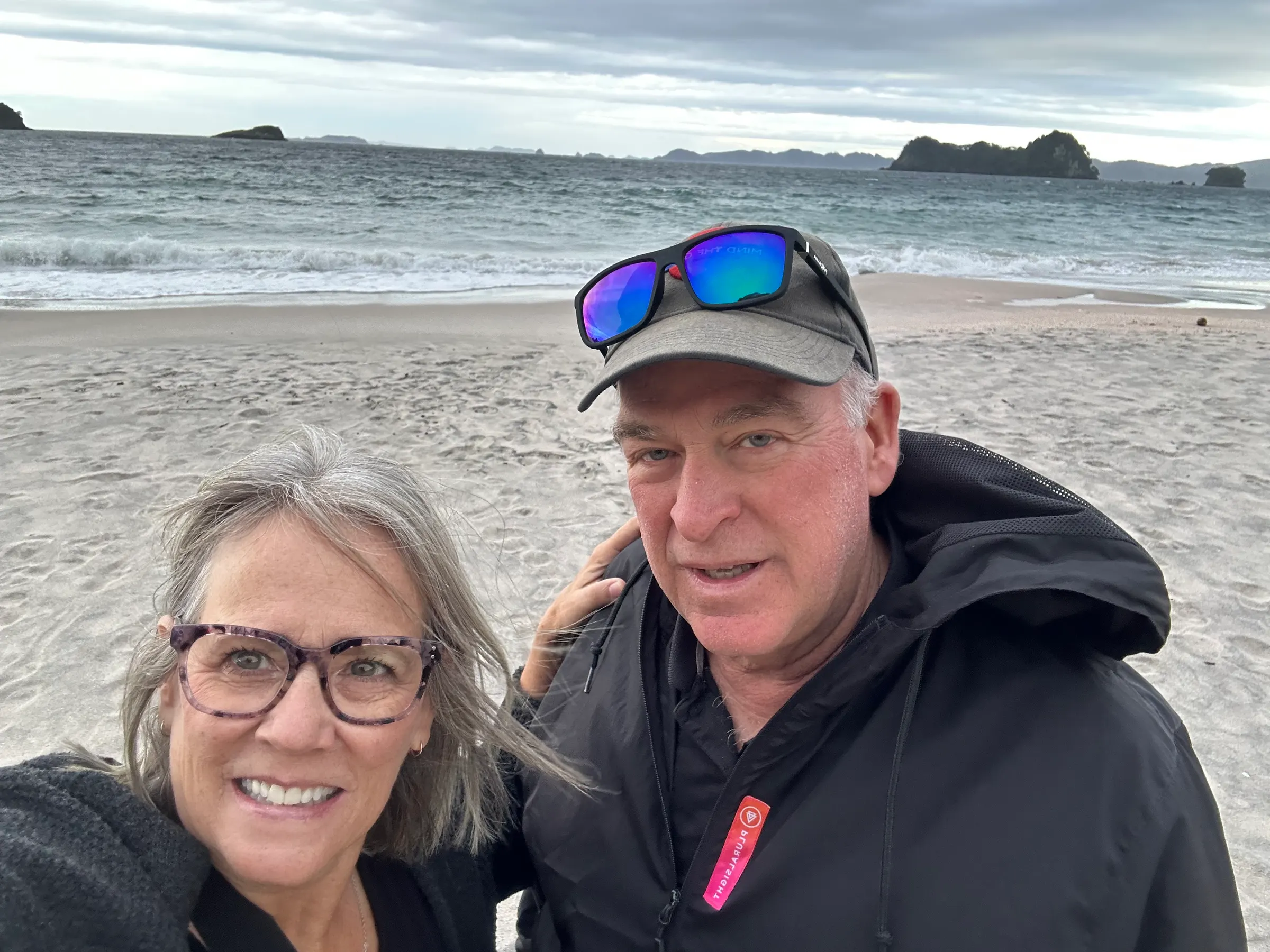 Us on Hahei Beach. Cold and windy it was.