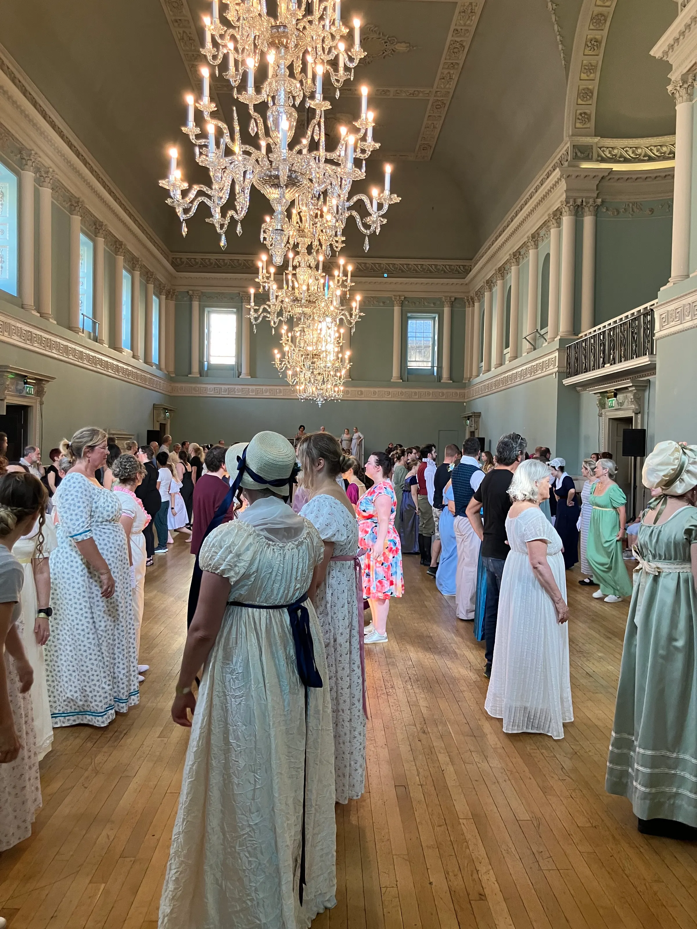 I snuck this picture before getting thrown out of people learning to dance the dances of the Jane Austen era. This room was pretty hot.