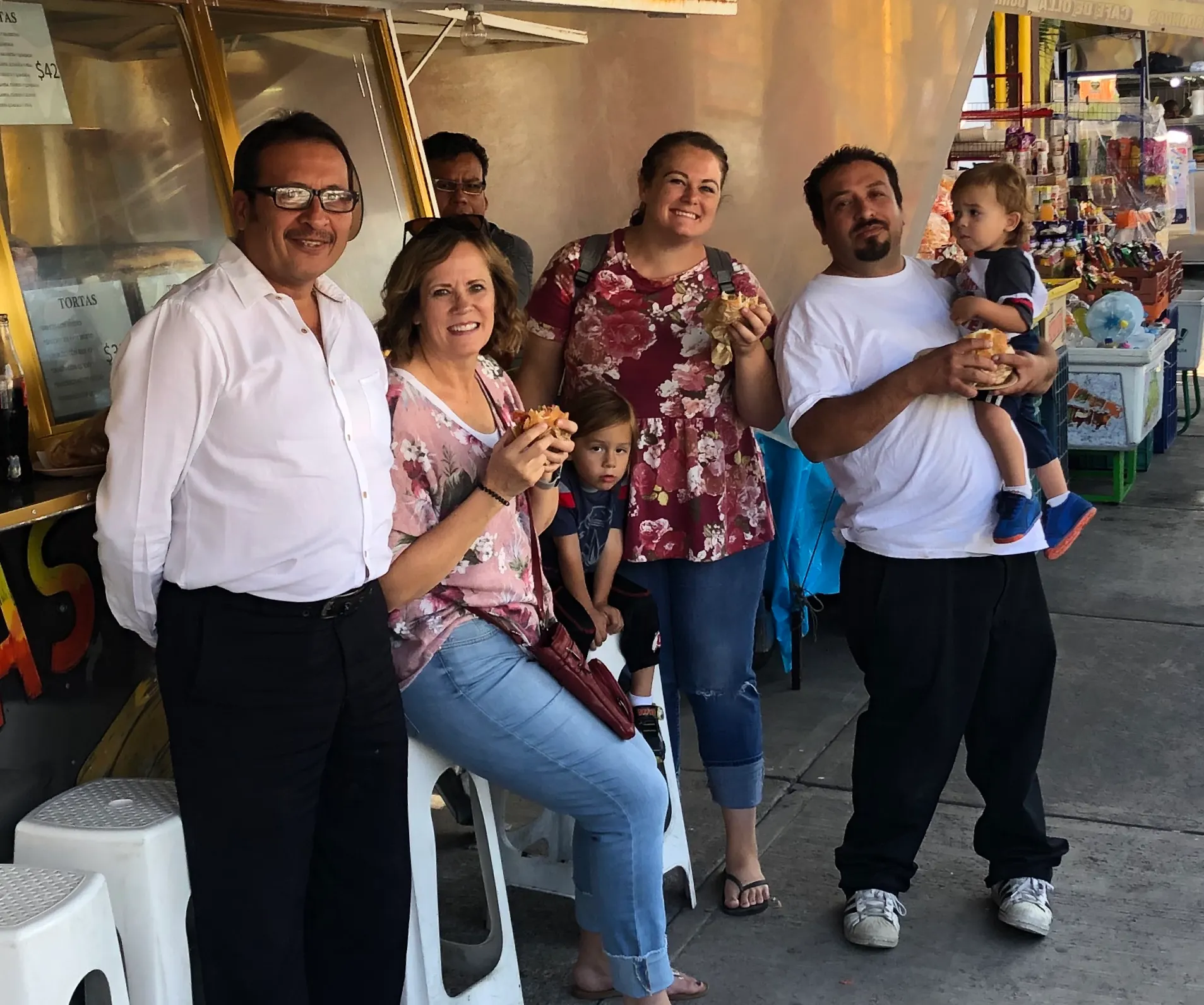 Juan, Denise, Karlie, Neza and Atticus eating tortas. Not sure who the photo bomber is in the back.