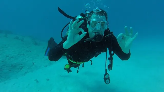 Some scuba pics....a good one of me saying that I'm having a blast! Thank you, Travis, for being a good son and being the underwater photographer. You did AWESOME. We all cannot wait to see all the footage!