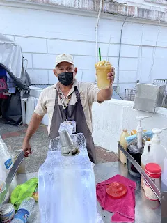 Our street vendor who made us this yummy shaved ice drink. You can see the large block of ice that he uses for his shaving of ice.