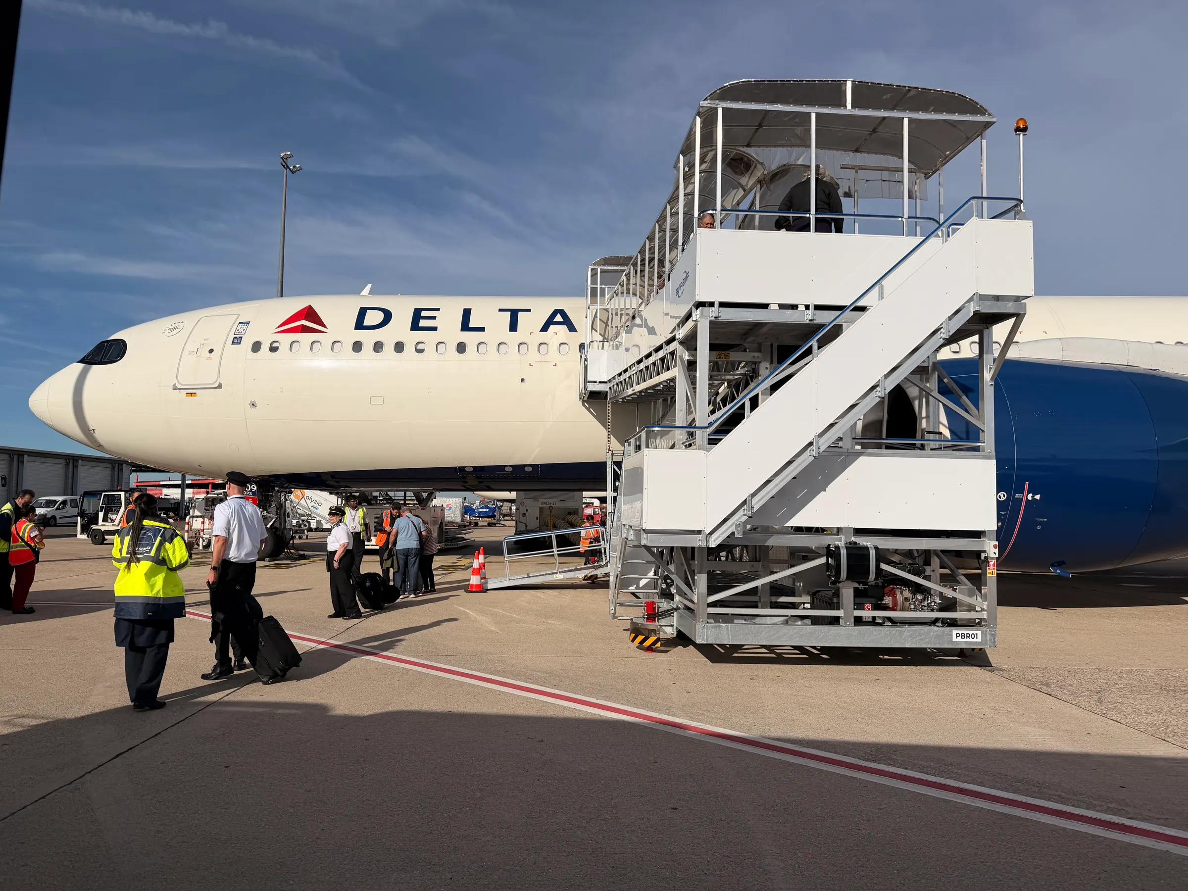 Our Jetway in CDG (Paris). I find this so crazy to have 250 people out on the tarmac. Very odd.