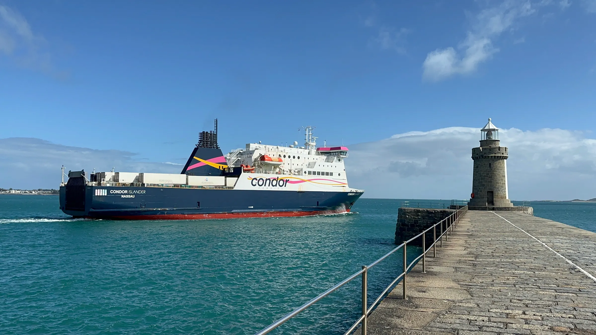 The ferry leaving port and passing the Lighthouse.