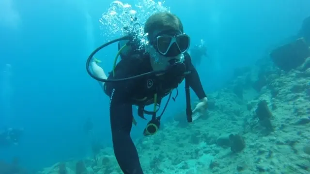 Kenzie still breathing.....but later she was stung by a sea urchin on her toe and had to go up.