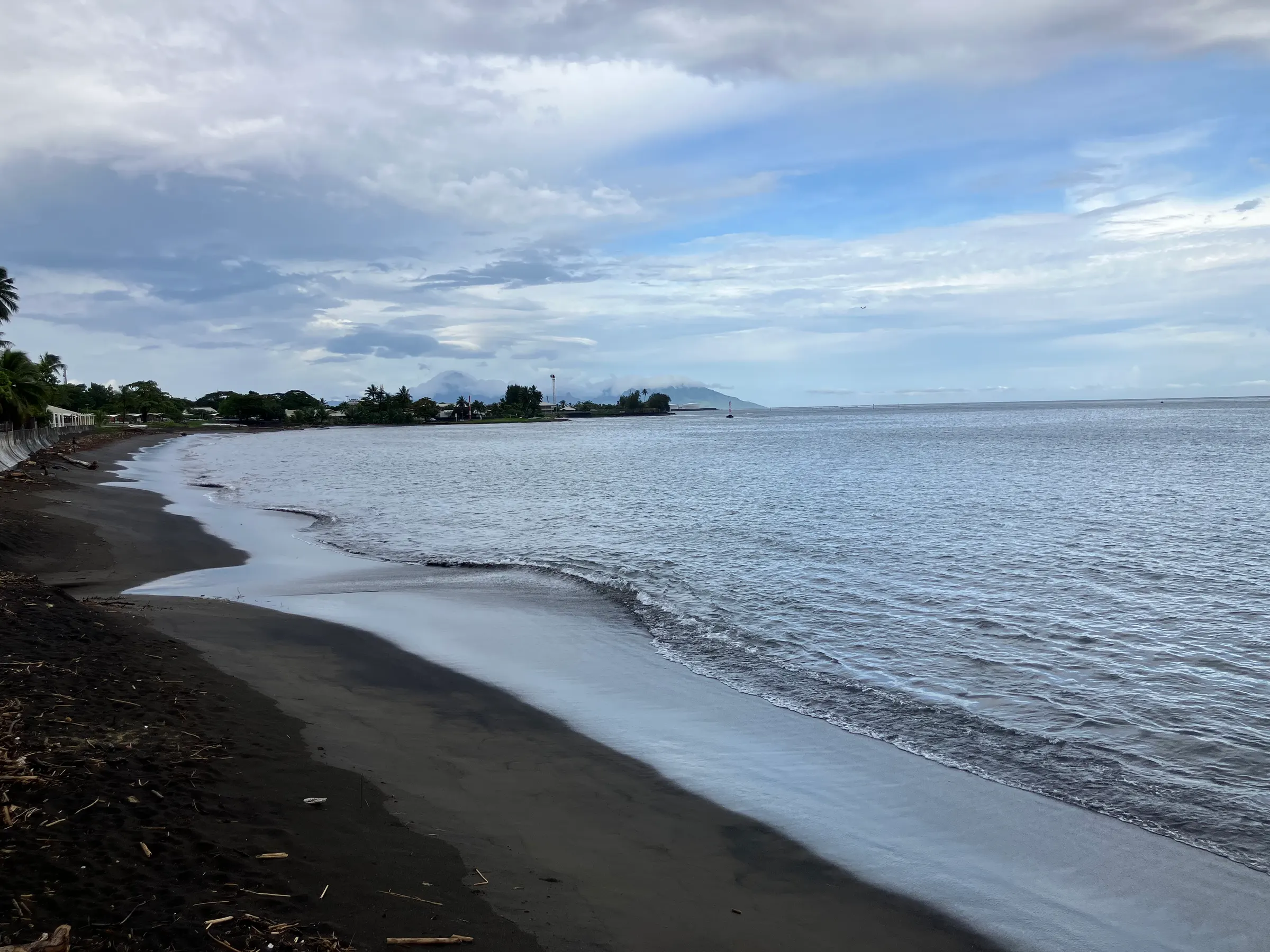 The beach here is a black sand beach. Would not be a good snorkel spot. But to go out and swim a bit, it might be nice.