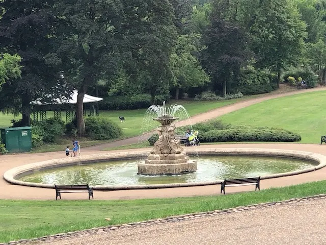 I nice fountain in the park. The kids to the left were jumping in and out of the water. I thought it was a cool day. But they seemed to think different.