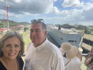 This is us with a picture of the boat going through the locks. It is almost out and into the Pacific Ocean at this point. The boat goes through two points where the water recedes and the boat lowers until it is level with the ocean.