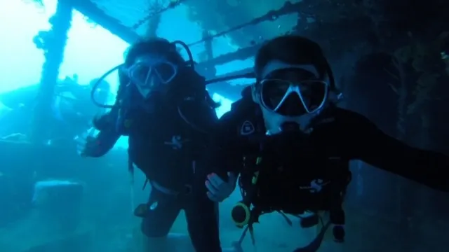 Kenzie and Travis inside the ship wreck....