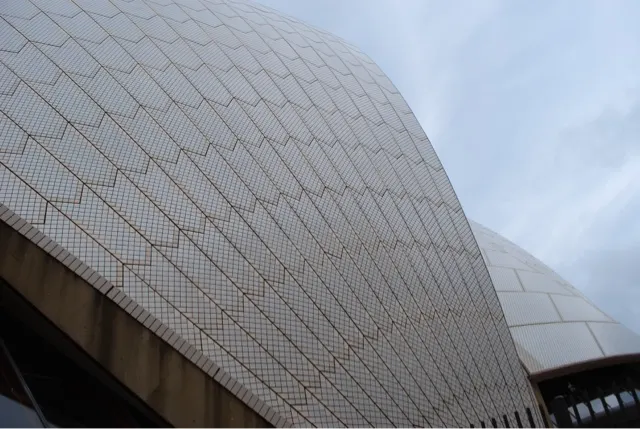 The outside shell is made up of mosaic like tiles that has some type of coating on it where a good rainstorm cleans them.